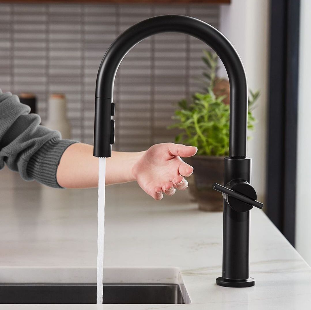 Kohler touchless matte black gooseneck kitchen faucet with a matte black undermount sink and marble counter 