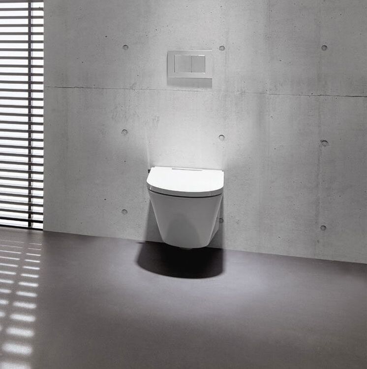 Axent Switzerland intelligent bidet toilet wall mounted on concrete panels in a loft bathroom