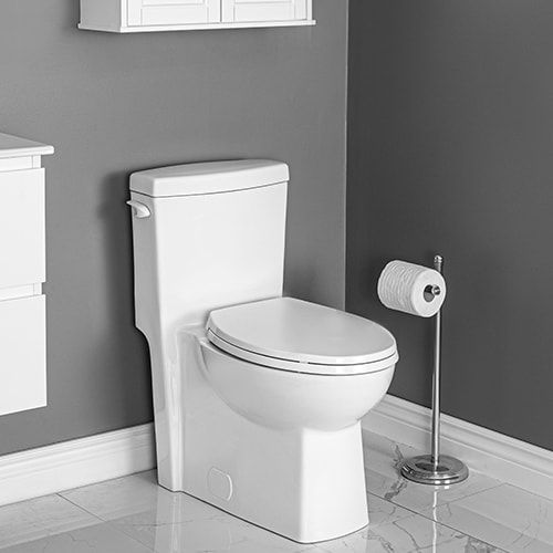 Contrac one piece comfort height modern toilet in a grey bathroom next to a freestanding toilet paper holder