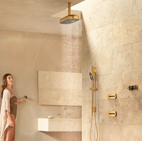 Kohler statement collection digital custom shower in brushed gold with a ceiling mounted rainhead,