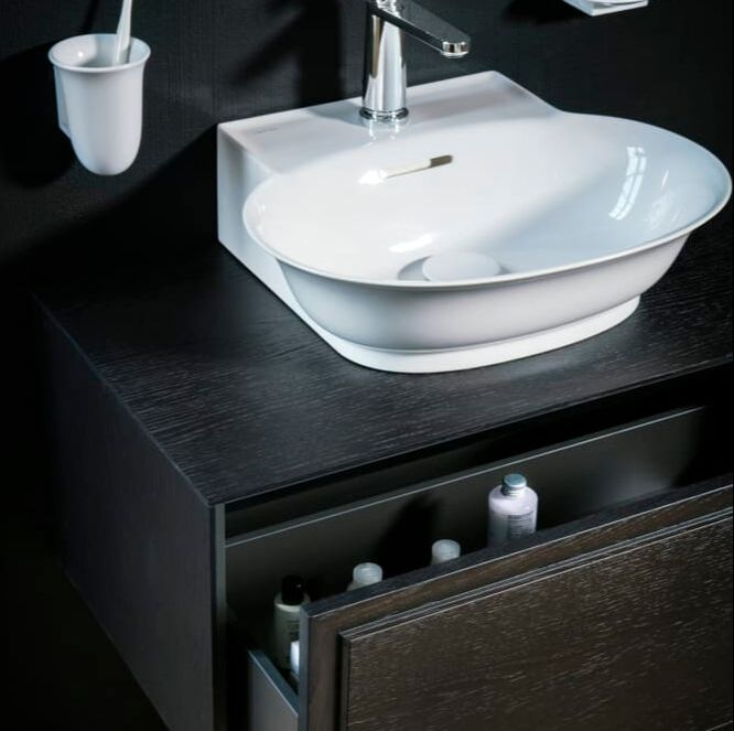 Black and white oak vanity by Laufen with new classic white vessel sink