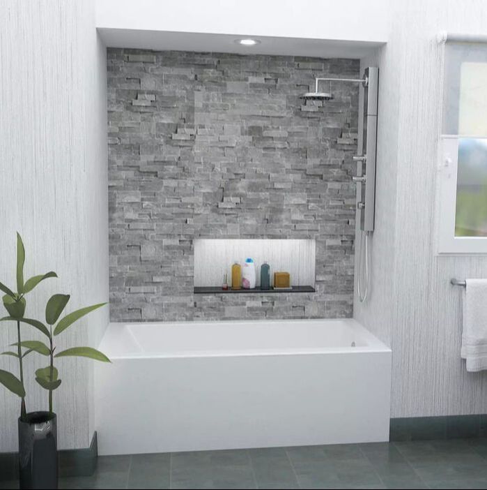Modern alcove mirolin bathtub with a grey brick faucet wall and steel shower panel with bodysprays and rainhead