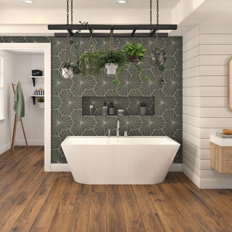 Oceania rupert freestanding bath in the center of a ensuire bathroom with wood floor and green midcentury modern tile accent wall