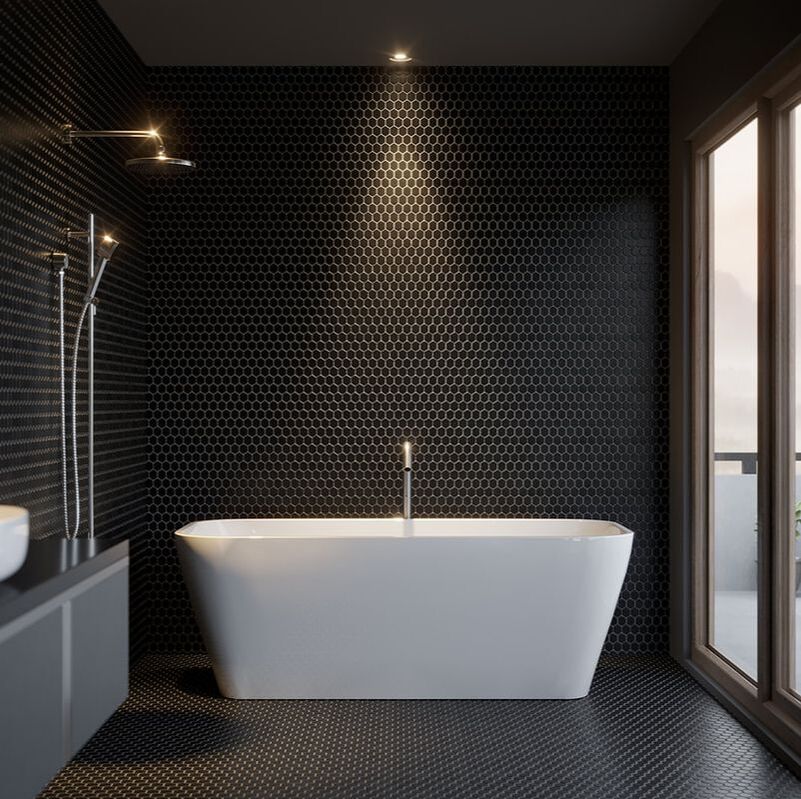 Modern bathroom with a freestanding bathtub in front of a black penny tile walls and floors