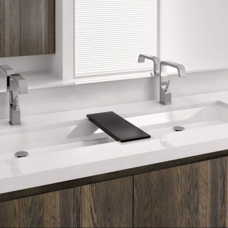 Wetstyle trough undermount sink with two faucets and a large medicine cabinet