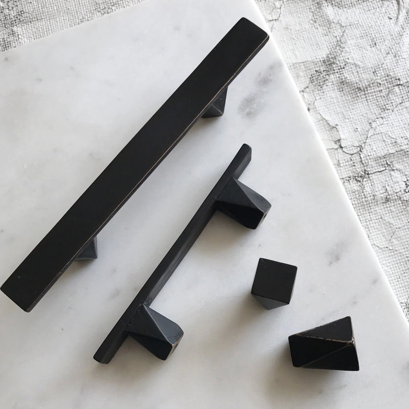 Matte black kitchen and bath cabinet pulls and knobs cast from solid bronze made by Shayne Fox in Canada