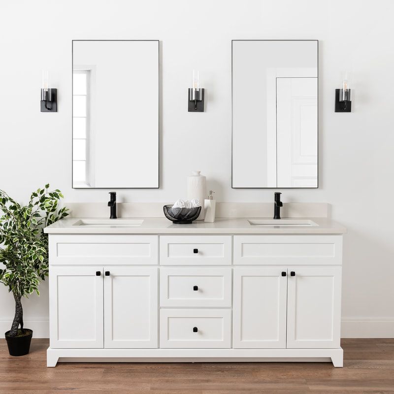 Stonewood white classic modern shaker vanity with double undermount sinks and matte black faucets and hardware with three modern black sconces and a lush green plant to the left