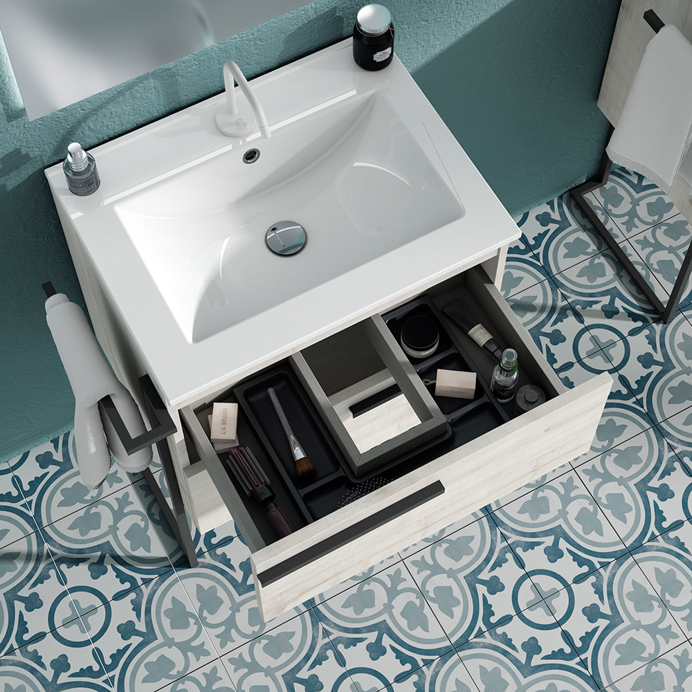 Ico accent vanity in white oak with a drawer organizer and seamless one-piece countertop over turqoise cement tiles with a matte white vanity